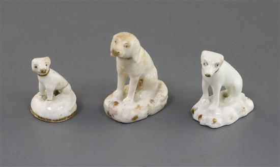 Three Rockingham porcelain toy figures of seated dogs, c.1830,